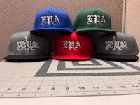 four hats with the word afa on them